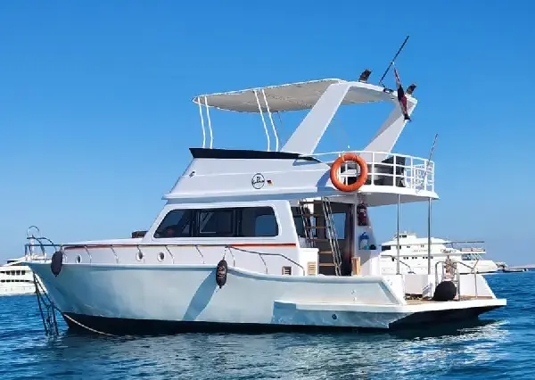 A luxury private boat cruising the turquoise waters of the Red Sea in Hurghada.