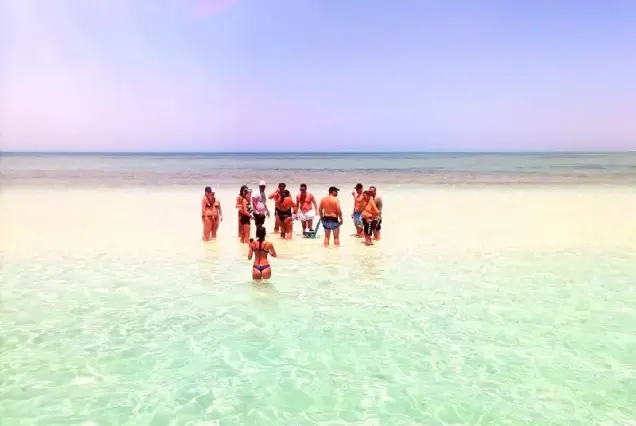Guests enjoying a sunny day on the Abu Minqar Island sandbar in Hurghada.