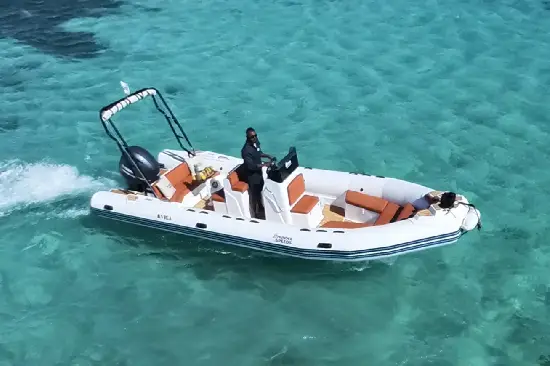 Rigid inflatable private speedboat operating in shallow clear Red Sea water